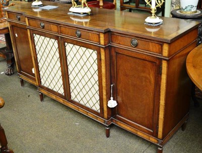 Lot 807 - Reproduction mahogany breakfront sideboard, cross banded top above four short drawers, two...