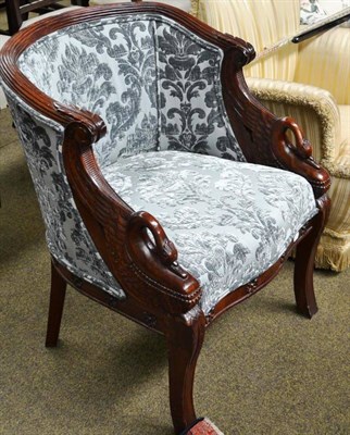 Lot 824 - A 20th century mahogany framed armchair with reeded frame and serpentine overstuffed seat