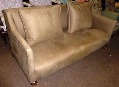 Lot 829 - A modern two seater sofa upholstered in green with two matching scatter cushions