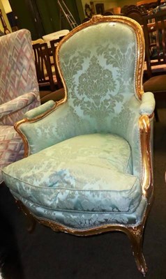 Lot 831 - # Louis XV style giltwood easy chair, upholstered in celadon coloured cotton brocade