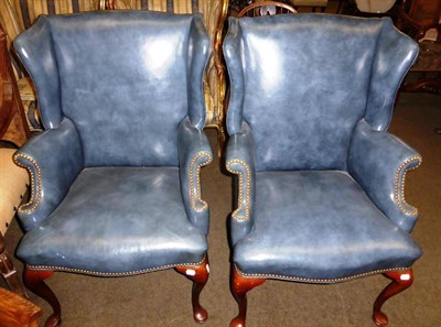 Lot 836 - Pair of Queen Anne style wing armchairs, upholstered in blue leather