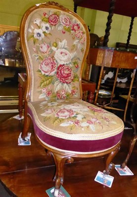 Lot 857 - Victorian walnut framed nursing chair with floral needlework cover