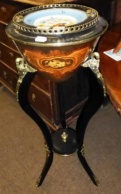 Lot 861 - A French Louis XV style ebonised jardiniere stand with removable top