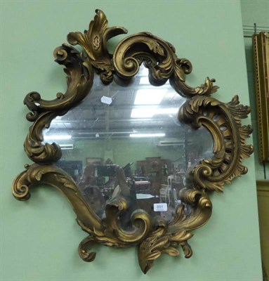 Lot 891 - A early 19th century gilt Rococo style mirror