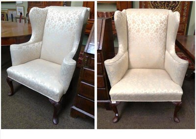 Lot 895 - Pair of Queen Anne style wingback armchairs upholstered in floral cream fabric