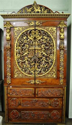 Lot 901 - A 19th century linen press with two cupboard doors, richly carved with classical figures and...