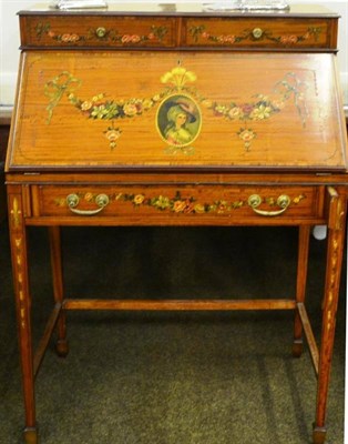 Lot 907 - An Edwardian satinwood painted bureau, the upper section with two drawers above a fall front...