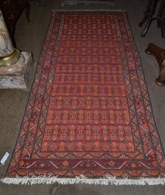 Lot 911 - Malayer rug, West Persia, the burnt orange lattice field of stylised flowerheads enclosed by...