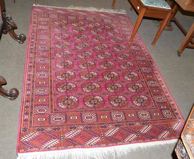 Lot 919 - Unusual Tekke rug, Emirate of Bukhara, the deep raspberry field with four rows of quartered...