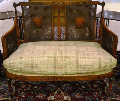 Lot 935 - An early 20th century painted satinwood two seater bergere sofa, 114cm wide