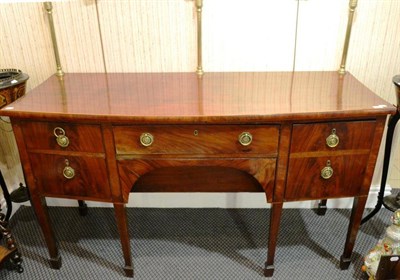 Lot 940 - George III mahogany bow fronted sideboard on square tapering legs and spade feet