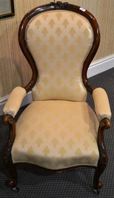 Lot 948 - A Victorian spoon back armchair