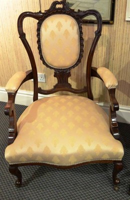 Lot 950 - A Victorian nursing or salon chair with padded support, seat and arms