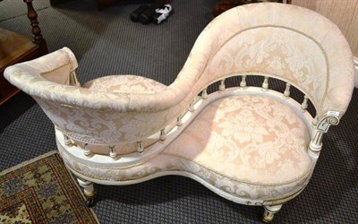 Lot 957 - A Victorian cream and gilt painted conversation settee