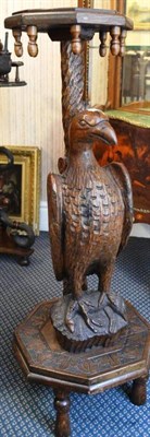 Lot 966 - A carved oak plant stand in the form of an eagle with twisted stem, 9cm high