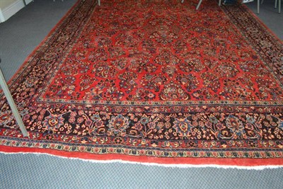 Lot 969 - Saroukh carpet, West Persia, the rose pink field with floral sprays enclosed by palmette and...