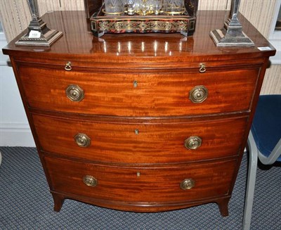 Lot 975 - Regency mahogany bow fronted chest with brushing slide