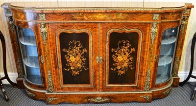 Lot 981 - A Victorian figures walnut and tulipwood banded credenza, with double bowed glazed cupboard...