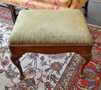 Lot 983 - A George II walnut dressing stool, 2nd quarter 18th century, with green velvet drop-in seat, raised