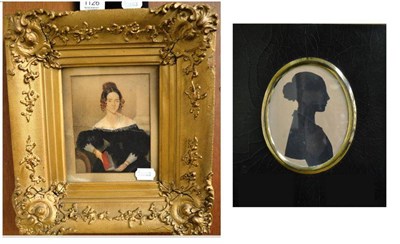 Lot 1126 - A 19th century silhouette and a portrait of a lady in a gilt frame (2)