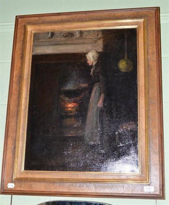 Lot 1157 - Mark Senior NPS (1864-1927) Cottage interior with a lady beside a fireplace, possibly Peggy...