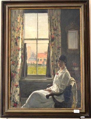 Lot 1169 - Circle of Fred Elwell (Early 20th century) Lady wearing a white dress seated in a chair by a...