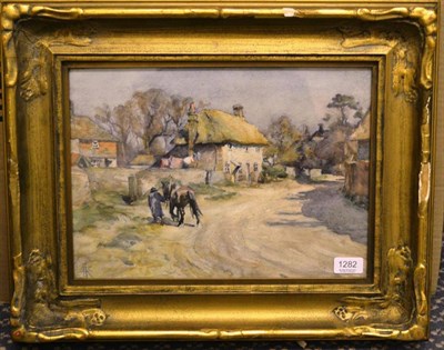 Lot 1282 - Nathaniel Hughes John Baird (1865-1936)  Figure leading a Shire horse into a farmhouse, signed with