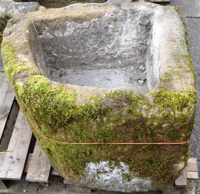 Lot 1402 - A garden triangular shaped stone trough, 78cm diameter