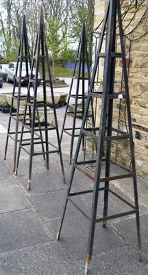 Lot 1423 - Four metal garden obelisks