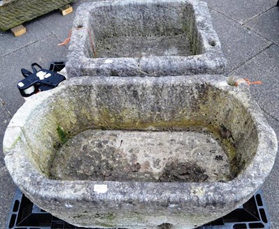 Lot 1427 - Rectangular stone trough, 69cm diameter and an oval example, 96cm wide