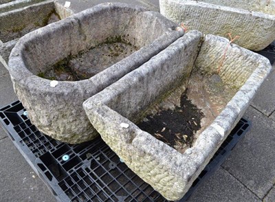 Lot 1437 - Rectangular stone garden trough, 88cm wide (a.f.); and an oval example, 96cm wide