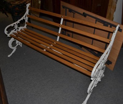 Lot 1442 - Victorian cast iron garden bench with Gothic style end supports, claw feet and an oak slatted seat