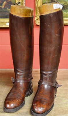 Lot 1472 - A pair of gentleman's brown leather riding boots, with brass spurs and straps and fitted wooden...