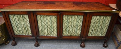 Lot 1496 - A Regency mahogany and brass alcove side cabinet, early 19th century, with canted sides and...