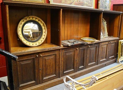 Lot 1498 - ^ Late Victorian oak bookcase, the upper section fitted with shelves, the base comprising eight...