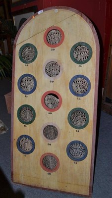 Lot 1506 - An early 20th century painted easel games board with string pockets labelled Hamley`s, Toys,...