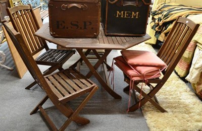 Lot 1507 - ^ Garden hardwood table and four folding chairs