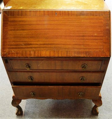 Lot 1516 - ^ A 20th century mahogany bureau, provincial oak dining table, butler's stand and an...