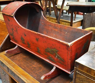 Lot 1541 - ^ A 19th century red japanned cradle