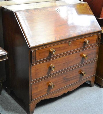 Lot 1542 - A 19th century mahogany bureau