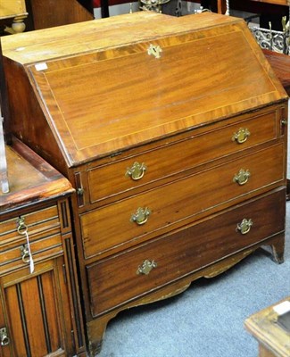 Lot 1544 - A 19th century mahogany bureau