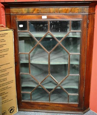 Lot 1551 - Late George III mahogany and astragal glazed corner cupboard, 103cm high