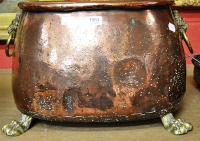 Lot 1553 - # Copper log bin of oval form, with brass lion mask loose ring handles, raised on lion paw...