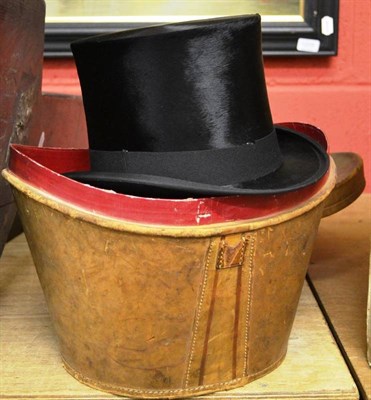 Lot 1555 - A gentleman's black silk top hat by Thomas Townend & Co, London, in a stitched leather case