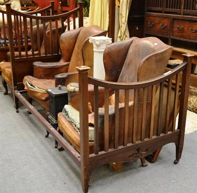 Lot 1571 - ^ Pair of walnut single bed ends and a pair of Victorian balloon back dining chairs