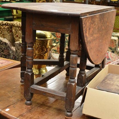 Lot 1578 - ^ An early 18th century oak gate leg table