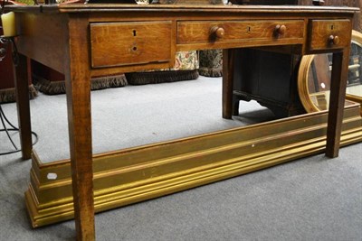 Lot 1582 - Grained pine writing table with green leather top