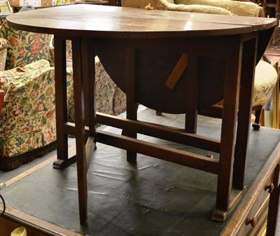 Lot 1583 - ^ Oak drop leaf table raised of sledge bases