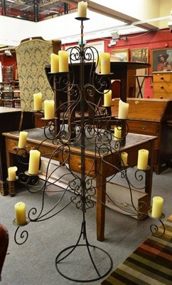 Lot 1584 - ^ Wrought iron four tier graduated candle stand