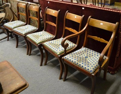 Lot 1589 - ^ Set of five late Regency mahogany dining chairs including one carver